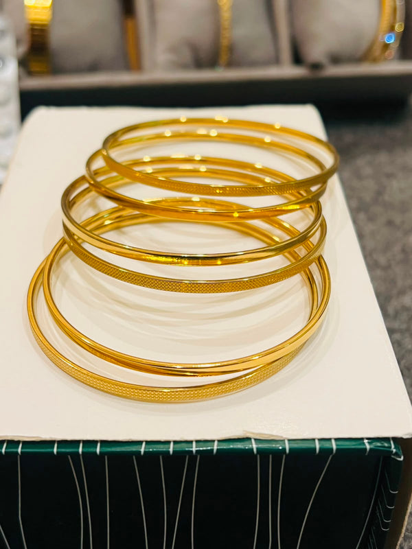 21 karat gold plated stainless bangles