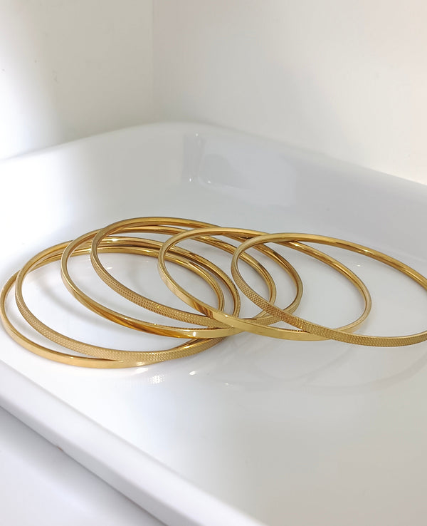 21 karat gold plated stainless bangles