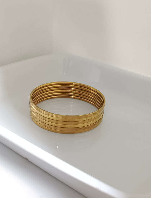 21 karat gold plated stainless bangles